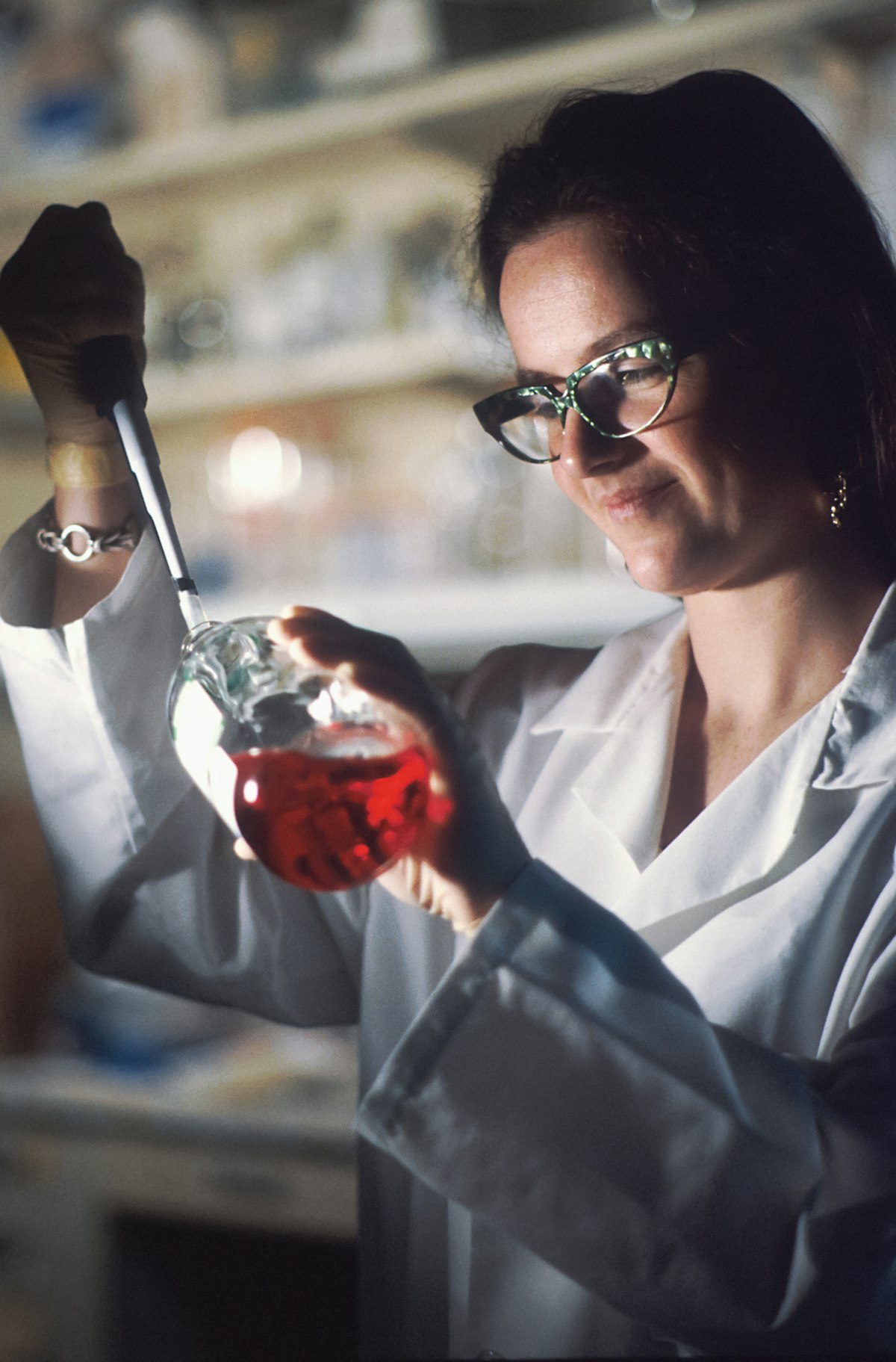 Scientist pipetting a sample in a quality-control laboratory